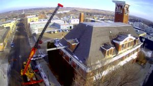 Crane service. new roof support beams into the old Brandon Firehall